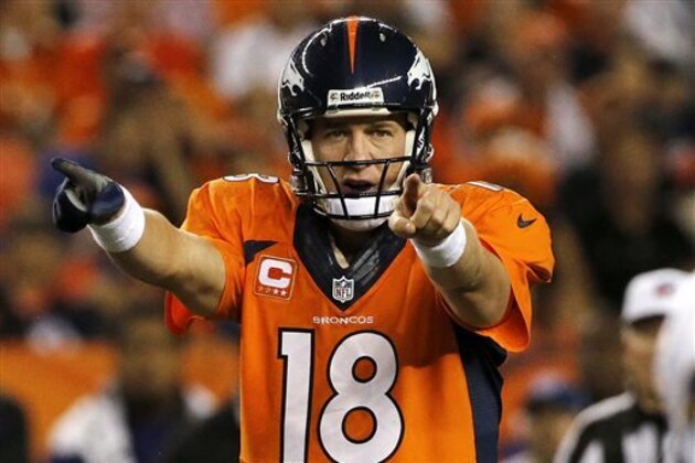 FILE - In this Sept. 5, 2013, file photo, Denver Broncos quarterback Peyton Manning (18) calls a play at the line of scrimmage during the first half of an NFL football game against the Baltimore Ravens in Denver. Manning is Sports Illustrated's Sportsman of the Year.  He is the fourth NFL quarterback to take the honor in the last nine years, following Brady in 2005, Brett Favre in 2007 and Drew Brees in 2010. LeBron James was the winner last year. (AP Photo/Ed Andrieski, File)