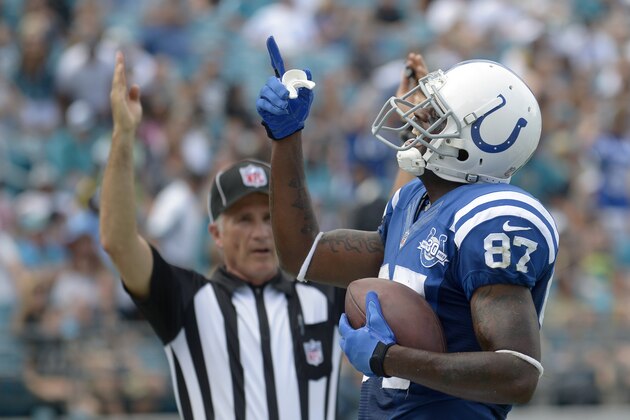 FILE - In this Sept. 29, 2013 file photo, Indianapolis Colts wide receiver Reggie Wayne (87) celebrates after catching a touchdown pass in the end zone during the first half of an NFL football game against the Jacksonville Jaguars in Jacksonville, Fla.The Colts have rallied round Wayne for years. Now, for the first time since became a major contributor, Indianapolis will find out what life is like without their talented receiver. (AP Photo/Phelan M. Ebenhack, File)