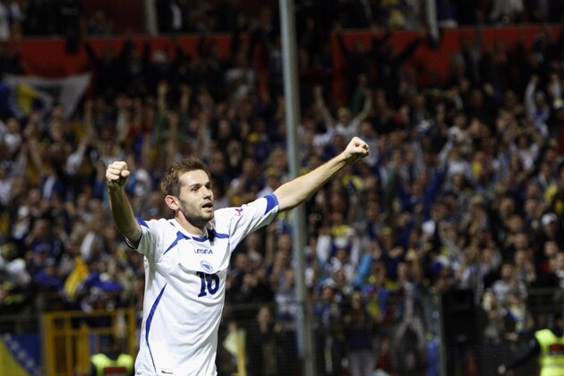 Bosnia's Senad Lulic celebrates his goal against Liechtenstein , during the World Cup 2014 Group G qualifying soccer match, at Stadium Bilino Polje  in Zenica, Bosnia, on  Friday, Oct. 11, 2013. (AP Photo/Amel Emric)