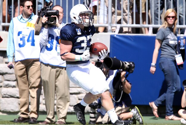 Apr 12, 2014; State College, PA, USA; Penn State Nittany Lions running back Cole Chiappialle (33) runs the ball into the end zone for a touchdown in the second quarter of the Blue White spring game at Beaver Stadium. Mandatory Credit: Matthew O'Haren-USA TODAY Sports Apr 12, 2014; State College, PA, USA; Penn State Nittany Lions running back Cole Chiappialle (33) runs the ball into the end zone for a touchdown in the second quarter of the Blue White spring game at Beaver Stadium. Mandatory Credit: Matthew O'Haren-USA TODAY Sports