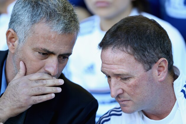 LIVERPOOL, ENGLAND - SEPTEMBER 14:  Chelsea Manager Jose Mourinho speaks to Assistant Steve Holland prior to the Barclays Premier League match between Everton and Chelsea at Goodison Park on September 14, 2013 in Liverpool, England.  (Photo by Clive Brunskill/Getty Images)
