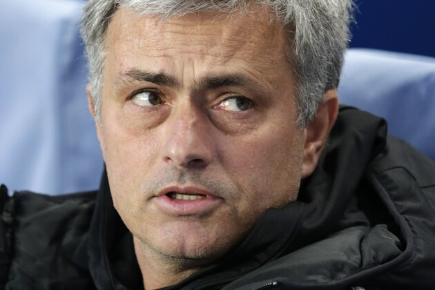 Chelsea's manager Jose Mourinho sits in the technical area prior to the start of the Champions League quarterfinal second leg soccer match between Chelsea and Paris Saint Germain at Stamford Bridge stadium in London, Tuesday, April 8, 2014. (AP Photo/Matt Dunham).