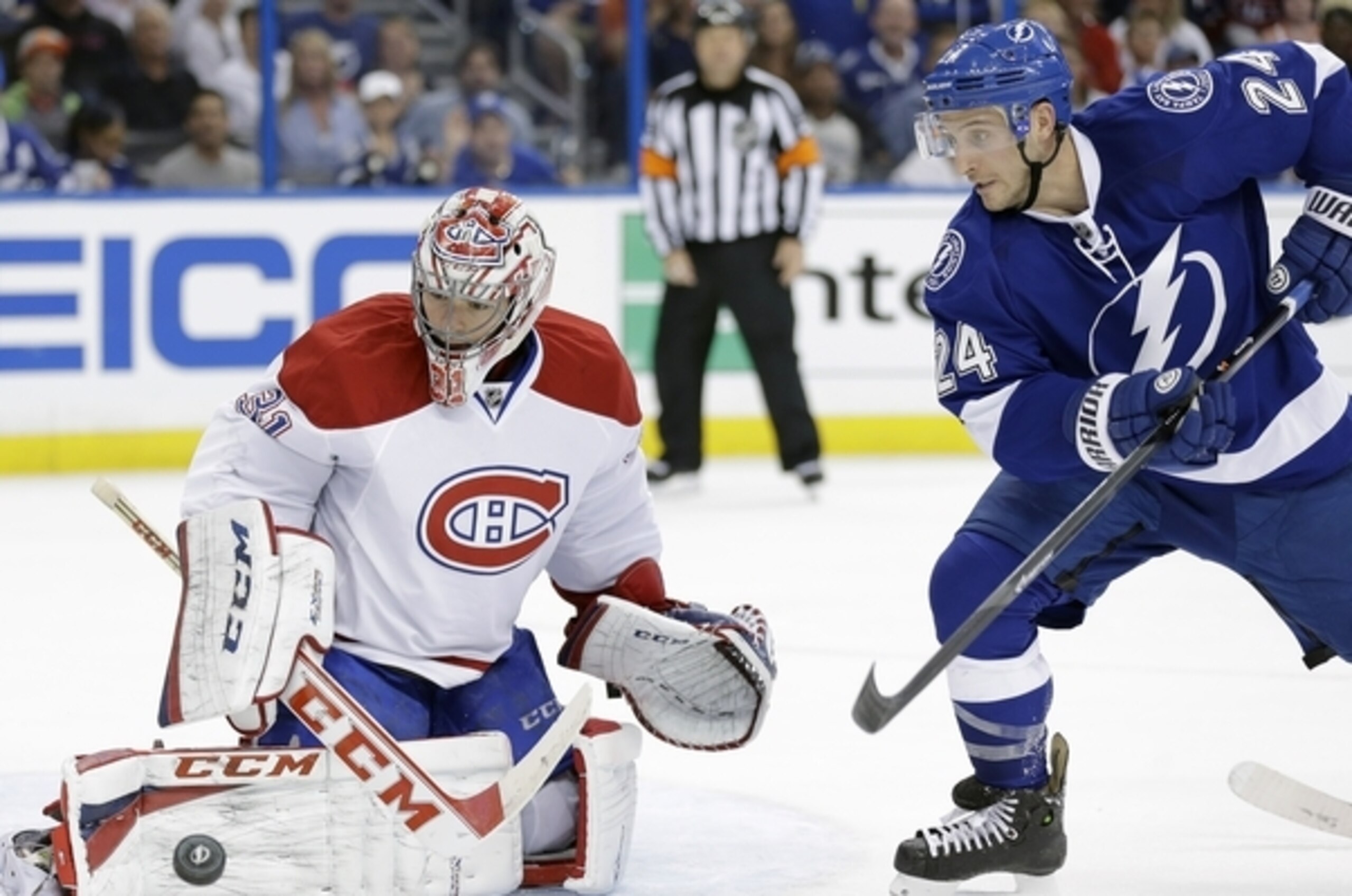 Montreal Canadiens goalie Carey Price (31) makes a save on a shot by Tampa Bay Lightning right wing Ryan Callahan (24) during the second period of Game 1 of a first-round NHL hockey playoff series on Wednesday, April 16, 2014, in Tampa, Fla. (AP Photo/Chris O'Meara)