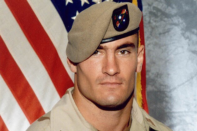 ** FILE ** Cpl. Pat Tillman is seen in a this 2003 file photo provided by Photography Plus. Just seven days after Pat Tillman's death, a top general warned there were strong indications that it was friendly fire and President Bush might embarrass himself if he said the NFL star-turned-soldier died in an ambush, according to a memo obtained by The Associated Press.  (AP Photo/Photography Plus via Williamson Stealth Media Solutions, FILE)