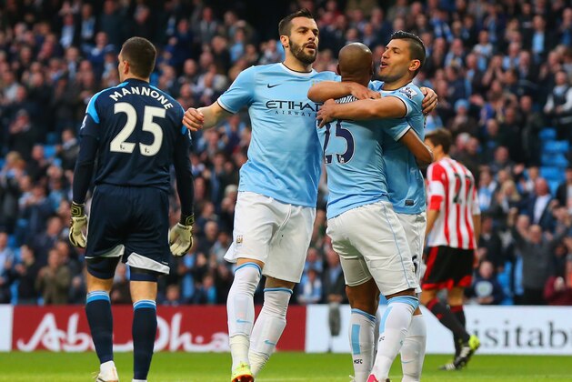 MANCHESTER, ENGLAND - APRIL 16:  Fernandinho of Manchester City celebrates after scoring the first goal with Sergio Aguero and Alvaro Negredo of Manchester City  during the Barclays Premier League match between Manchester City and Sunderland at Etihad Stadium on April 16, 2014 in Manchester, England.  (Photo by Alex Livesey/Getty Images)