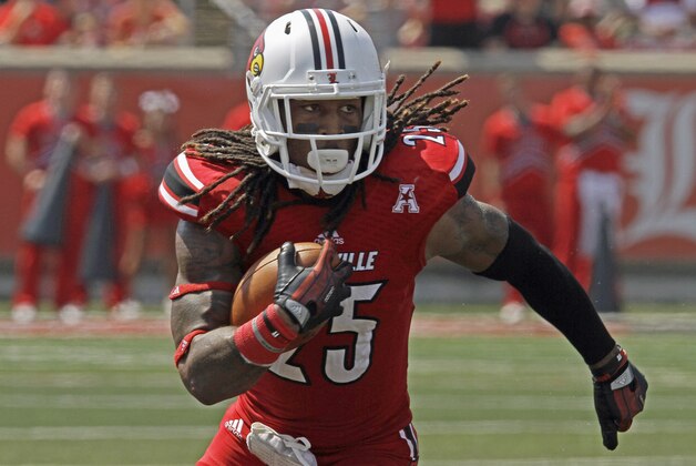 Louisville's Calvin Pryor turns and runs after picking off a pass against Eastern Kentucky in their NCAA college football game in Louisville, Ky., Saturday, Sept. 7, 2013. Louisville beat Eastern Kentucky 44-7.  (AP Photo/Garry Jones)