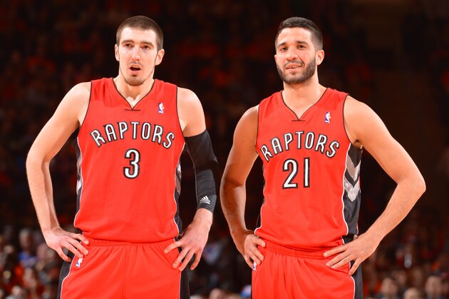 NEW YORK, NY - APRIL 16: Nando de Colo #3 and Greivis Vasquez #21 of the Toronto Raptors look on against the New York Knicks during the game on April 16, 2014 at Madison Square Garden in New York City, New York. NOTE TO USER: User expressly acknowledges and agrees that, by downloading and or using this photograph, User is consenting to the terms and conditions of the Getty Images License Agreement. Mandatory Copyright Notice: Copyright 2014 NBAE (Photo by Jesse D. Garrabrant/NBAE via Getty Images)