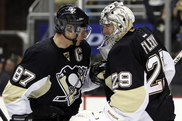 PITTSBURGH, PA - APRIL 16:  Sidney Crosby #87 of the Pittsburgh Penguins celebrates with Marc-Andre Fleury #29 after defeating the Columbus Blue Jackets in Game One of the First Round of the 2014 NHL Stanley Cup Playoffs at Consol Energy Center on April 16, 2014 in Pittsburgh, Pennsylvania.  The Penguins defeated the Blue Jackets 4-3.  (Photo by Justin K. Aller/Getty Images)
