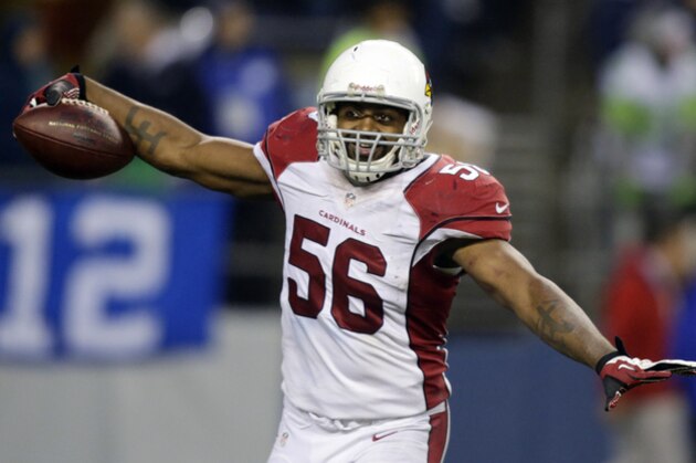 Arizona Cardinals Karlos Dansby celebrates after he made an interception against the Seattle Seahawks in the second half of an NFL football game, Sunday, Dec. 22, 2013, in Seattle. The Cardinals won 17-10. (AP Photo/Stephen Brashear)