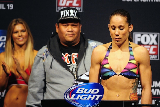Apr 18, 2014; Orlando, FL, USA; Liz Carmouche steps on the scale during a weigh-in her female bantamweight fight against Miesha Tate for UFC on FOX 11at Amway Center. Mandatory Credit: David Manning-USA TODAY Sports