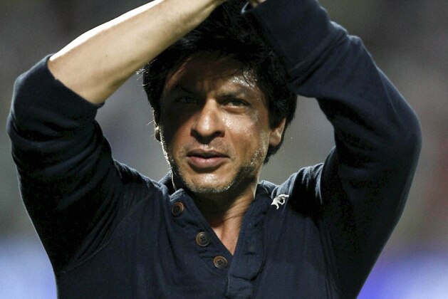 Kolkata Knight Riders' co owner and Bollywood star Shah Rukh Khan, greets the crowd as he celebrates his team's victory in their Indian Premier League (IPL) cricket playoff match against Delhi Daredevils in Pune, India, Tuesday, May 22, 2012. (AP Photo) INDIA OUT