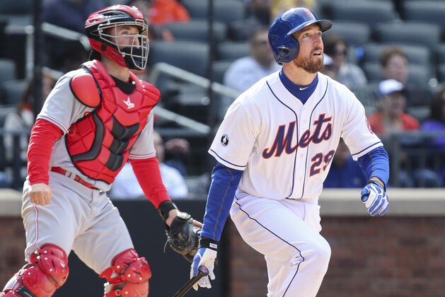 New York Mets first baseman Ike Davis (29) hits a walk-off grand slam in the ninth inning of their baseball game against the Cincinnati Reds at Citi Field, Saturday, April 5, 2014, in New York. The Mets defeated the Reds, 6-3. (AP Photo/John Minchillo)