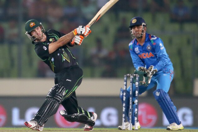 DHAKA, BANGLADESH - MARCH 30: Glenn Maxwell of Australia hits a six as MS Dhoni of India looks on during the ICC World Twenty20 Bangladesh 2014 match between India v Australia at Sher-e-Bangla Mirpur Stadium on March 30, 2014 in Dhaka, Bangladesh. (Photo by Scott Barbour/Getty Images) DHAKA, BANGLADESH - MARCH 30: Glenn Maxwell of Australia hits a six as MS Dhoni of India looks on during the ICC World Twenty20 Bangladesh 2014 match between India v Australia at Sher-e-Bangla Mirpur Stadium on March 30, 2014 in Dhaka, Bangladesh. (Photo by Scott Barbour/Getty Images)