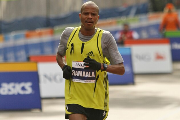 South Africa's Hendrick Ramaala crosses the finish line in third place in the men's division in the New York City Marathon in New York, Sunday, Nov. 4, 2007. (AP Photo/Kathy Willens)