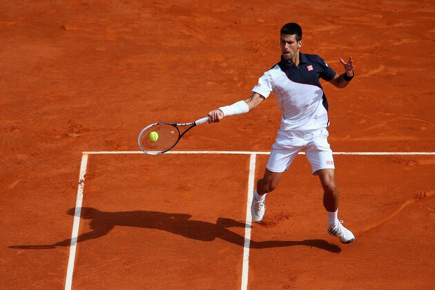 MONTE-CARLO, MONACO - APRIL 19:  Novak Djokovic of Serbia in action against Roger Federer of Switzerland in the semi finals during day seven of the ATP Monte Carlo Rolex Masters Tennis at Monte-Carlo Sporting Club on April 19, 2014 in Monte-Carlo, Monaco.  (Photo by Julian Finney/Getty Images)