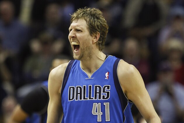 Dallas Mavericks forward Dirk Nowitzki (41), of Germany, cries out after scoring against the Memphis Grizzlies in the second half of an NBA basketball game Wednesday, April 16, 2014, in Memphis, Tenn. The Grizzlies won in overtime 106-105. (AP Photo/Lance Murphey)