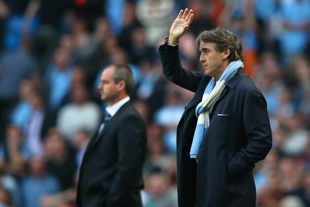 MANCHESTER, ENGLAND - MAY 07:  Manchester City Manager Roberto Mancini gestures during the Barclays Premier League match between Manchester City and West Bromwich Albion at the Etihad Stadium on May 07, 2013 in Manchester, England.  (Photo by Alex Livesey/Getty Images)