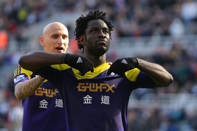 NEWCASTLE-UPON-TYNE, ENGLAND - APRIL 19:  Wilfried Bony of Swansea City celebrates with Jonjo Shelvey of Swansea City (L) after scoring the winning goal during the Barclays Premier League fixture between Newcastle United and Swansea City at St. James Park on April 19, 2014 in Newcastle-upon-Tyne, England. (Photo by Dave Thompson/Getty Images)