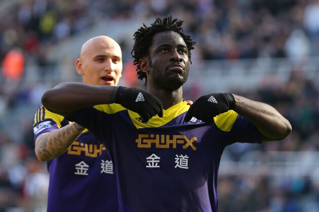 NEWCASTLE-UPON-TYNE, ENGLAND - APRIL 19: Wilfried Bony of Swansea City celebrates with Jonjo Shelvey of Swansea City (L) after scoring the winning goal during the Barclays Premier League fixture between Newcastle United and Swansea City at St. James Park on April 19, 2014 in Newcastle-upon-Tyne, England. (Photo by Dave Thompson/Getty Images) NEWCASTLE-UPON-TYNE, ENGLAND - APRIL 19: Wilfried Bony of Swansea City celebrates with Jonjo Shelvey of Swansea City (L) after scoring the winning goal during the Barclays Premier League fixture between Newcastle United and Swansea City at St. James Park on April 19, 2014 in Newcastle-upon-Tyne, England. (Photo by Dave Thompson/Getty Images)