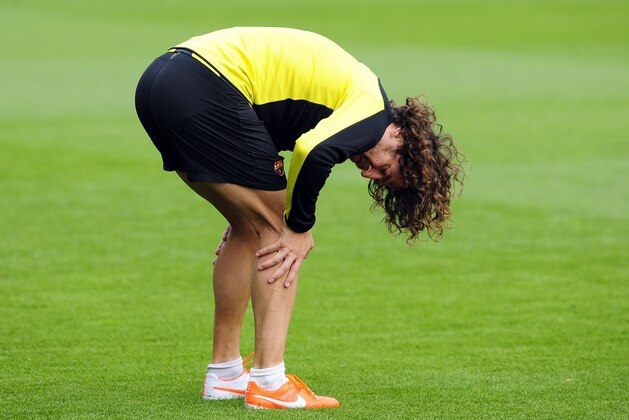 FC Barcelona's Carles Puyol attends a a training session at the Sports Center FC Barcelona Joan Gamper in San Joan Despi, Spain, Monday, March 31, 2014. FC Barcelona will face Atletico Madrid in a first leg quarter-final Champions League soccer match on April 1. (AP Photo/Manu Fernandez)