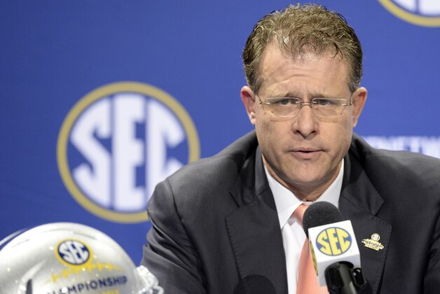Dec 6, 2013; Atlanta, GA, USA;  Auburn Tigers head coach Gus Malzahn addresses the media at a press conference the day before his team faces the Missouri Tigers in the SEC Championship Game at the Georgia Dome. Mandatory Credit: John David Mercer-USA TODAY Sports
