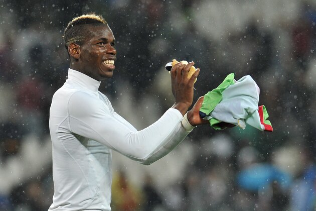 TURIN, ITALY - APRIL 19:  Paul Pogba of Juventus celebrates victory at the end of the Serie A match between Juventus and Bologna FC at Juventus Arena on April 19, 2014 in Turin, Italy.  (Photo by Valerio Pennicino/Getty Images)