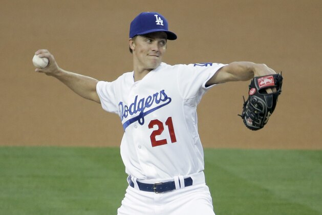 Los Angeles Dodgers starting pitcher Zack Greinke throws to the Arizona Diamondbacks during first inning of a baseball game in Los Angeles, Friday, April 18, 2014. (AP Photo/Chris Carlson)