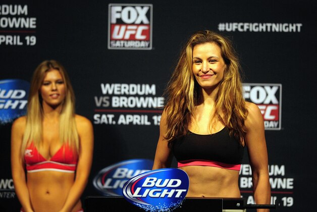 Apr 18, 2014; Orlando, FL, USA; Miesha Tate steps on the scale during a weigh-in her female bantamweight fight against Liz Carmouche for UFC on FOX 11at Amway Center. Mandatory Credit: David Manning-USA TODAY Sports