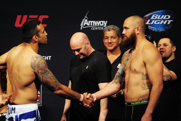 Apr 18, 2014; Orlando, FL, USA; Fabricio Werdum (left) shakes hands with Travis Browne (right) in front of UFC president Dana White during a weigh-in for a heavyweight match for UFC on FOX 11 at Amway Center. Mandatory Credit: David Manning-USA TODAY Sports Apr 18, 2014; Orlando, FL, USA; Fabricio Werdum (left) shakes hands with Travis Browne (right) in front of UFC president Dana White during a weigh-in for a heavyweight match for UFC on FOX 11 at Amway Center. Mandatory Credit: David Manning-USA TODAY Sports