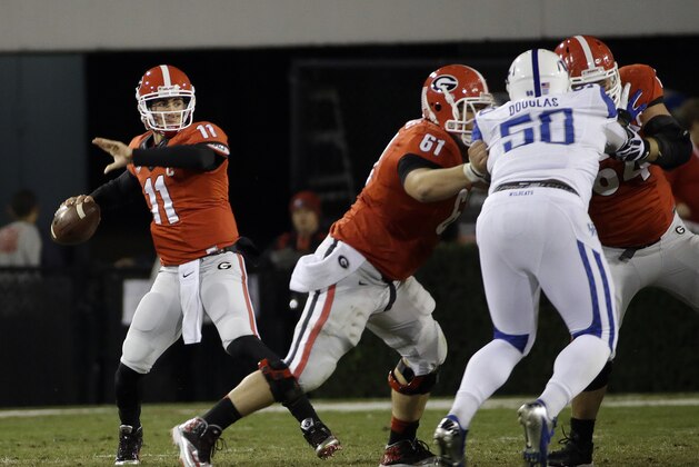 Georgia quarterback Aaron Murray (11) throws from the pocket in the first half of an NCAA college football game against Kentucky, Saturday, Nov. 23, 2013, in Athens, Ga. (AP Photo/John Bazemore)