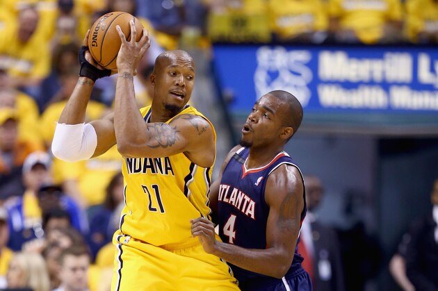 INDIANAPOLIS, IN - APRIL 19:  Paul Milsap #4 of the Atllanta Hawks defends David West #21 of the Indiana Pacers in Game 1 of the Eastern Conference Quarterfinals during the 2014 NBA Playoffs at Bankers Life Fieldhouse on April 19, 2014 in Indianapolis, Indiana. NOTE TO USER: User expressly acknowledges and agrees that, by downloading and or using this photograph, User is consenting to the terms and conditions of the Getty Images License Agreement.  (Photo by Andy Lyons/Getty Images)