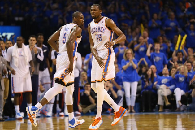 OKLAHOMA CITY, OK - APRIL 19: (L-R) Serge Ibaka #9 of the Oklahoma City Thunder and Kevin Durant #35 celebrate against the Memphis Grizzlies in Game One of the Western Conference Quarterfinals during the 2014 NBA Playoffs at Chesapeake Energy Arena on April 19, 2014 in Oklahoma City, Oklahoma.  NOTE TO USER: User expressly acknowledges and agrees that, by downloading and or using this photograph, User is consenting to the terms and conditions of the Getty Images License Agreement.  (Photo by Ronald Martinez/Getty Images)