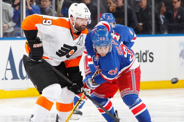 NEW YORK, NY - APRIL 17:  Martin St. Louis #26 of the New York Rangers and Scott Hartnell #19 of the Philadelphia Flyers battle for the puck in Game One of the First Round of the 2014 Stanley Cup Playoffs at Madison Square Garden on April 17, 2014 in New York City. (Photo by Scott Levy/NHLI via Getty Images)