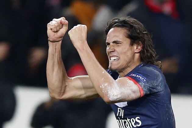 PSG's forward Edinson Cavani from Uruguay celebrates after scoring his side's 2nd goal during the Group C Champions League soccer match between Paris Saint Germain and Olympiakos FC at the Parc des Princes stadium in Paris, France, Wednesday, Nov. 27, 2013. (AP Photo/Francois Mori)