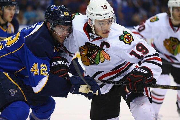 ST. LOUIS, MO - APRIL 19: David Backes #42 of the St. Louis Blues and Jonathan Toews #19 of the Chicago Blackhawks keep their eyes on the puck after a face off in Game Two of the First Round of the 2014 Stanley Cup Playoffs at the Scottrade Center on April 19, 2014 in St. Louis, Missouri.  (Photo by Dilip Vishwanat/Getty Images)