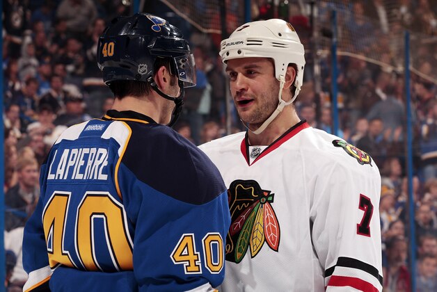 ST. LOUIS, MO - APRIL 17: Brent Seabrook #7 of the Chicago Blackhawks talks with Maxim Lapierre #40 of the St. Louis Blues in Game One of the First Round of the 2014 Stanley Cup Playoffs at the Scottrade Center on April 17, 2014 in St. Louis, Missouri. (Photo by Mark Buckner/NHLI via Getty Images)