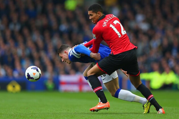 LIVERPOOL, ENGLAND - APRIL 20: Ross Barkley of Everton and Chris Smalling of Manchester United tussle for the ball during the Barclays Premier League match between Everton and Manchester United at Goodison Park on April 20, 2014 in Liverpool, England.  (Photo by Alex Livesey/Getty Images)
