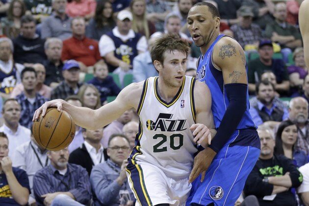 Utah Jazz's Gordon Hayward (20) drives around Dallas Mavericks' Shawn Marion, right, in the second half during an NBA basketball game Tuesday, April 8, 2014, in Salt Lake City. (AP Photo/Rick Bowmer)