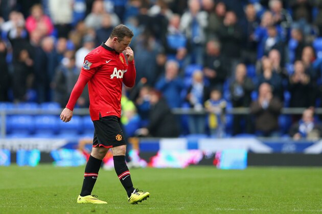 LIVERPOOL, ENGLAND - APRIL 20:  A dejected Wayne Rooney of Manchester United after defeat during the Barclays Premier League match between Everton and Manchester United at Goodison Park on April 20, 2014 in Liverpool, England.  (Photo by Clive Brunskill/Getty Images)