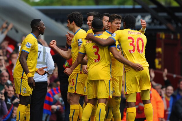 LONDON, ENGLAND - APRIL 19:  Mile Jedinak of Crystal Palace celebrates with team mates after scoring the first goal from the penalty spot during the Barclays Premier League match between West Ham United and Crystal Palace at Boleyn Ground on April 19, 2014 in London, England.  (Photo by Steve Bardens/Getty Images)