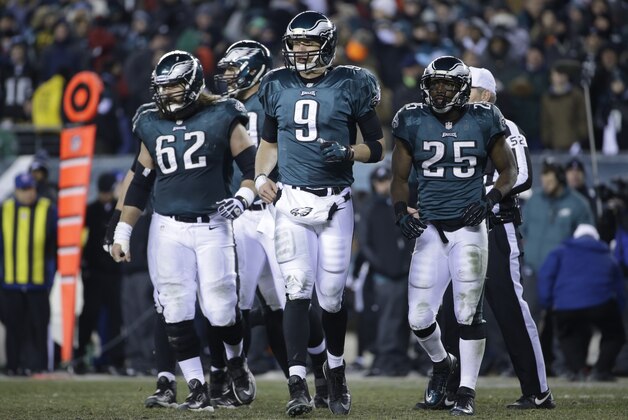 Philadelphia Eagles' Nick Foles walks onto the field during the second half of an NFL wild-card playoff football game against the New Orleans Saints, Saturday, Jan. 4, 2014, in Philadelphia. (AP Photo/Matt Rourke)