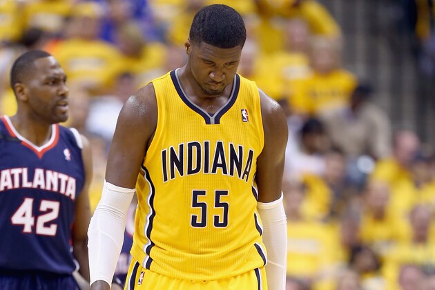 Indiana Pacers' Roy Hibbert looks at the scoreboard during the second half in Game 1 of an opening-round NBA basketball playoff series against the Atlanta Hawks, Saturday, April 19, 2014, in Indianapolis. Atlanta defeated Indiana 101-93. (AP Photo/Darron Cummings)