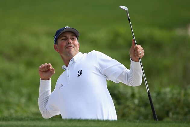 HILTON HEAD ISLAND, SC - APRIL 20:  Matt Kuchar celebrates on the 18th green during the final round of the RBC Heritage at Harbour Town Golf Links on April 20, 2014 in Hilton Head Island, South Carolina.  (Photo by Streeter Lecka/Getty Images)