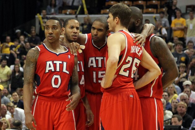 May 1, 2013; Indianapolis, IN, USA; Atlanta Hawks Jeff Teague (0), Devin Harris (34), Al Horford (15), Ivan Johnson (44) and Kyle Korver (26) huddle up as a team in a game against the Indiana Pacers in game five of the first round of the 2013 NBA Playoffs at Bankers Life Fieldhouse. Indiana defeats Atlanta 106-83. Mandatory Credit: Brian Spurlock-USA TODAY Sports