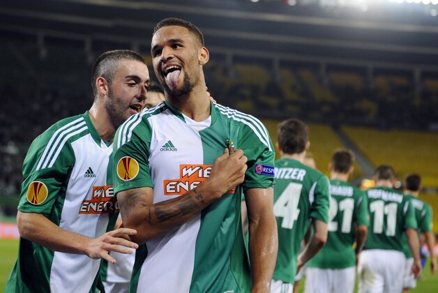 Rapid's Terrence Boyd, right, celebrates with Thanos Petsos after scoring during the  Europa League   group G soccer match between SK Rapid Vienna and KRC Genk, Vienna, Austria, Thursday, Nov. 7, 2013. (AP Photo/Hans Punz)p