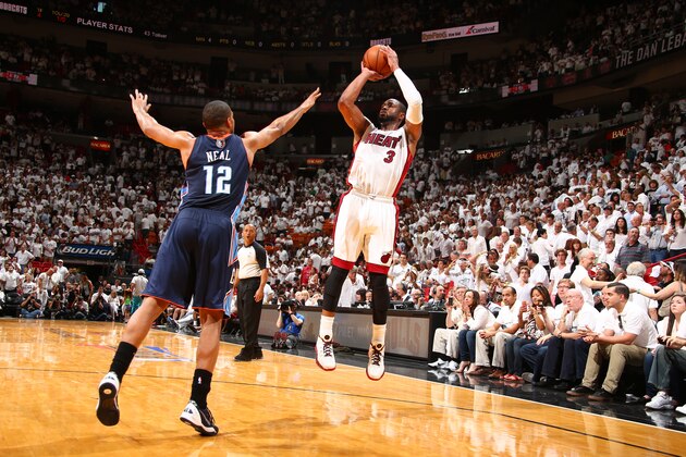 MIAMI, FL - April 20: Dwyane Wade #3 of the Miami Heat shoots against the Charlotte Bobcats during Game One of the Eastern Conference Quarterfinals of the 2014 NBA playoffs at the American Airlines Arena in Miami, Florida on April 20, 2014. NOTE TO USER: User expressly acknowledges and agrees that, by downloading and/or using this photograph, user is consenting to the terms and conditions of the Getty Images License Agreement. Mandatory copyright notice: Copyright NBAE 2014 (Photo by Nathaniel S. Butler/NBAE via Getty Images)