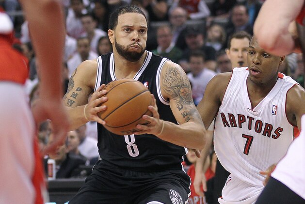 TORONTO, ON - APRIL 19:  Deron Williams #8 of the Brooklyn Nets looks to make a play against the Toronto Raptors in Game One of the NBA Eastern Conference play-off at the Air Canada Centre on April 19, 2014 in Toronto, Ontario, Canada. The Nets defeated the Raptors 94-87 to take a 1-0 series lead. NOTE TO USER: user expressly acknowledges and agrees that, by downloading and/or using this Photograph, user is consenting to the terms and conditions of the Getty Images License Agreement. (Photo by Claus Andersen/Getty Images)