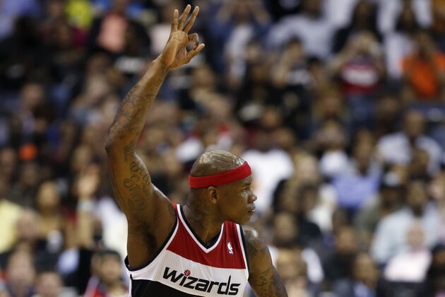 Washington Wizards forward Al Harrington (7) reacts after a three-point shot in the first half of an NBA basketball game against the Miami Heat, Monday, April 14, 2014, in Washington. (AP Photo/Alex Brandon)