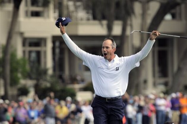 Matt Kuchar celebrates making birdie out of the bunker on the 18th green to win the final round of the RBC Heritage golf tournament in Hilton Head Island, S.C., Sunday, April 20, 2014. (AP Photo/Stephen B. Morton)