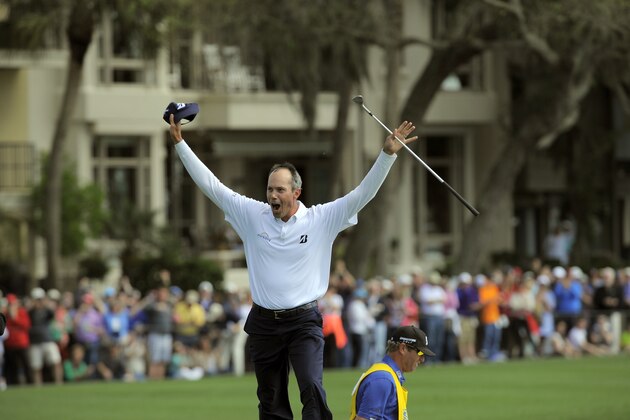 Matt Kuchar celebrates a birdie out of the bunker on the 18th green to win the final round of the RBC Heritage golf tournament in Hilton Head Island, S.C., Sunday, April 20, 2014. Kuchar won the tournament with 11-under par. (AP Photo/Stephen B. Morton)